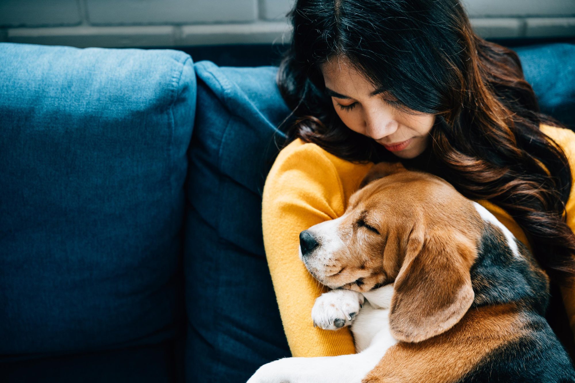 woman holding dog.